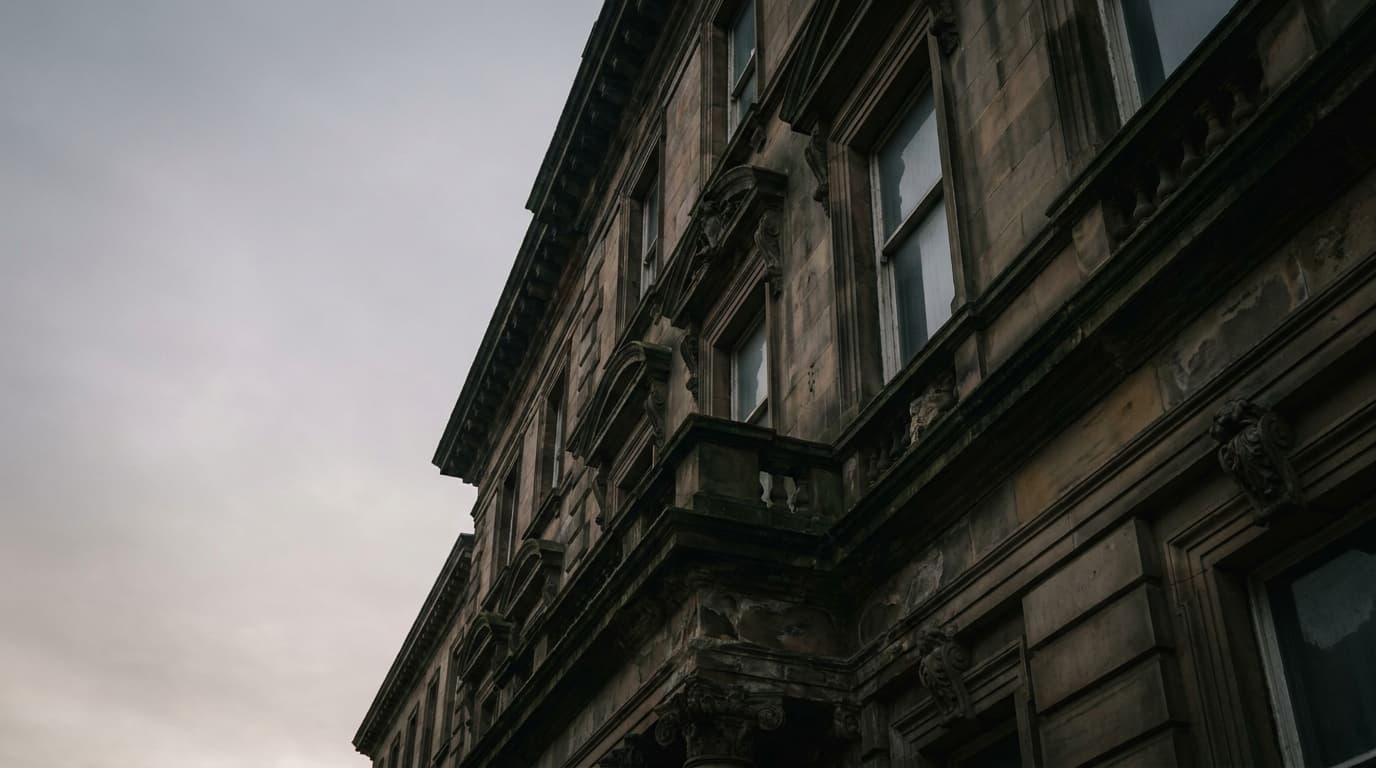 An ornate Victorian stone facade at dawn, deeply recessed cornices and ledges, no proofing fitted